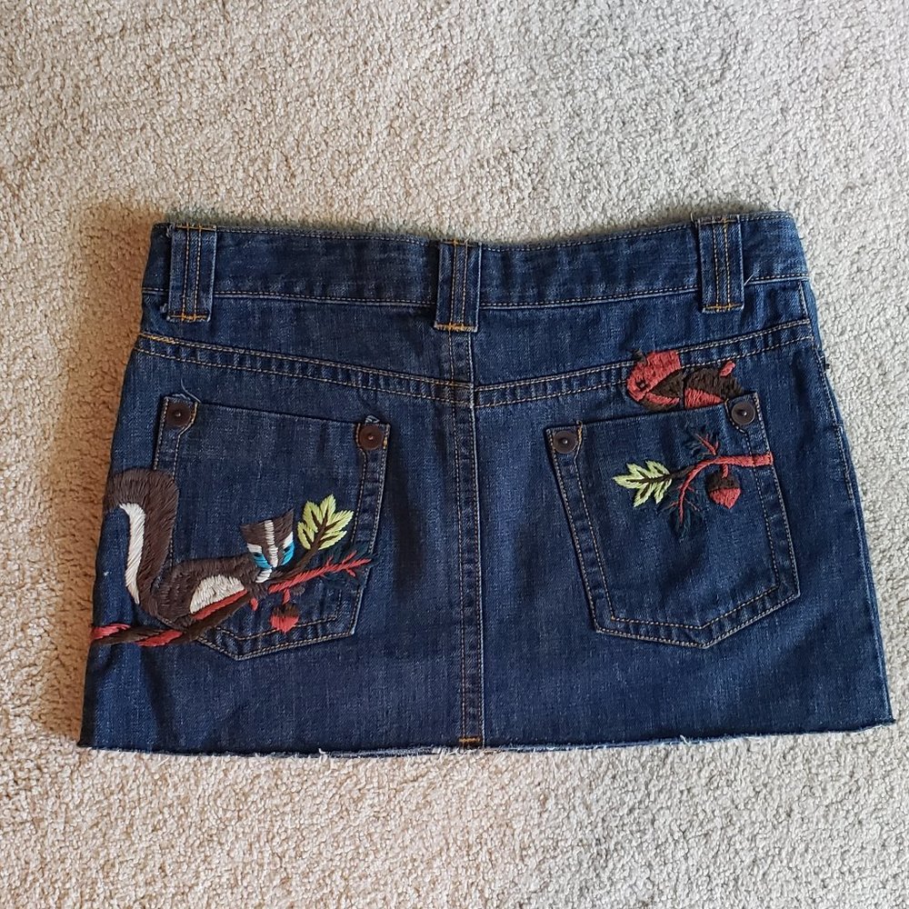 Denim skirt with embroidered squirrel, acorns, and leaves
